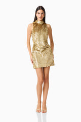 Model wearing Mercelline Embellished Mini Dress in Gold with high neckline & sequin fabrication posed shot