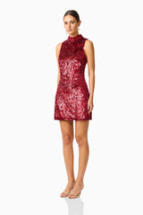 Model wearing Mercelline Embellished Mini Dress in Red with sequin fabrication & high neckline side shot