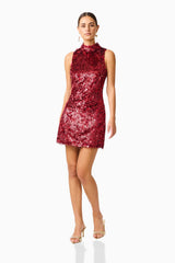 Model wearing Mercelline Embellished Mini Dress in Red with sequin fabrication & high neckline posed shot