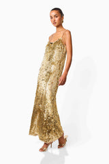 Mercelline Embellished Gown in Gold with a scoop neckline & sequin fabrication side posed shot