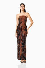 Giada Column Gown Dress in Chocolate Brown with a strapless straight neckline and 3D floral applique posed shot