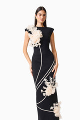 Martina Applique Gown in Black with boat neck and 3D floral detailing posed close up shot 