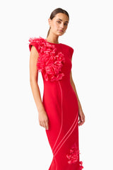 Martina Applique Gown in Red with boat neckline and flower details posed close up shot
