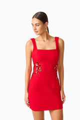 Solina Party Mini Dress in Red with square neckline & floral embellishments close up looking away shot