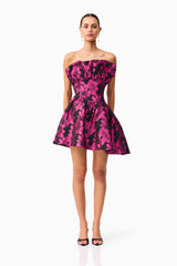 Brunette model wearing the Holly Asymmetrical Mini Dress in Pink & Black Floral front shot