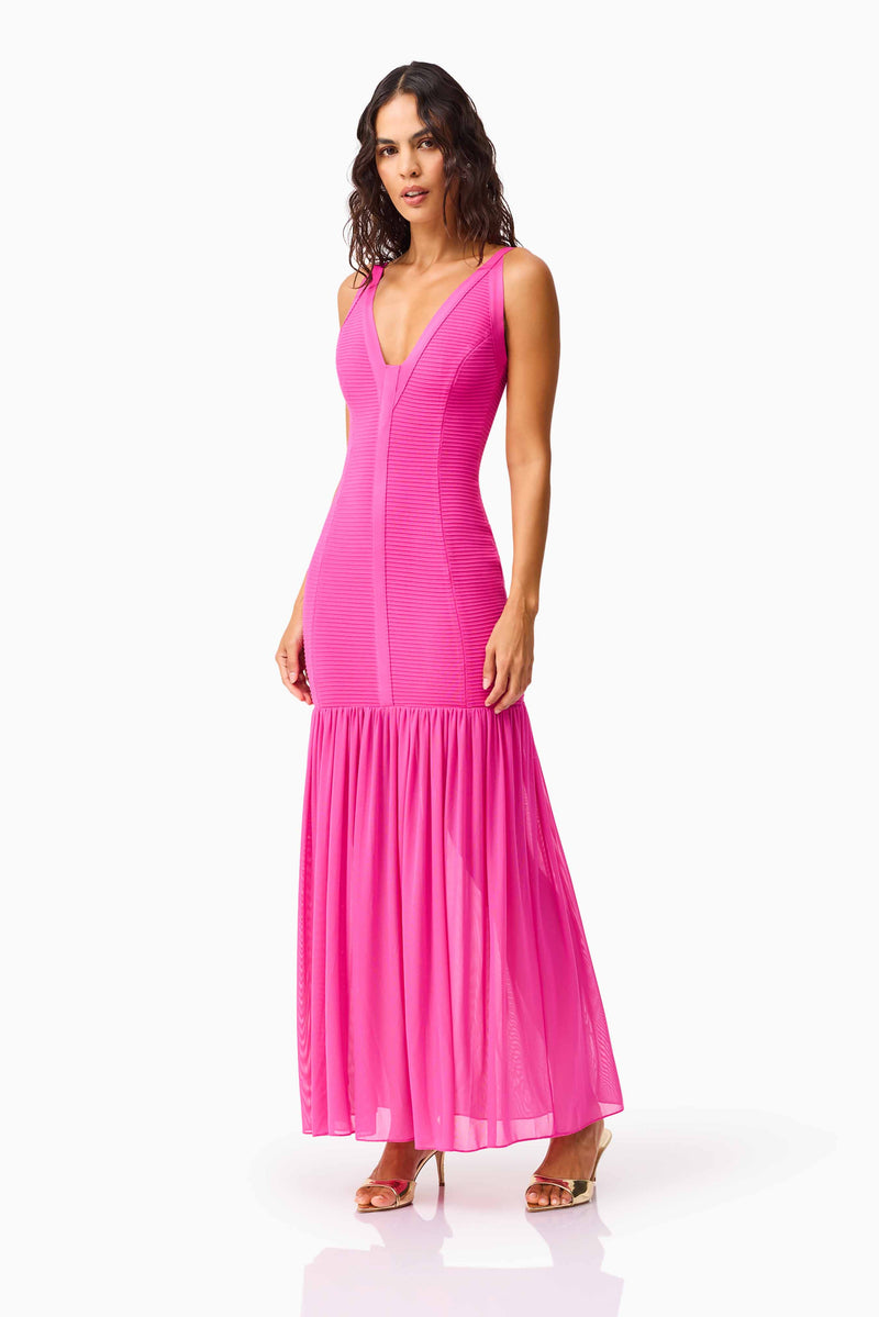Brunette model wearing the Seraphina Gown in Pink side posed shot