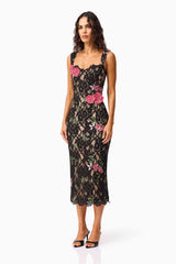 Brunette model wearing the Morgaine Lace Midi Dress in Black side shot