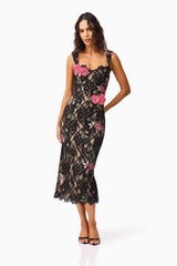 Brunette model wearing the Morgaine Lace Midi Dress in Black posed shot