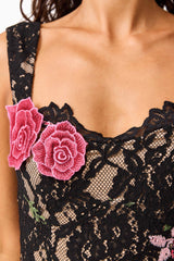 Brunette model wearing the Morgaine Lace Midi Dress in Black detail shot