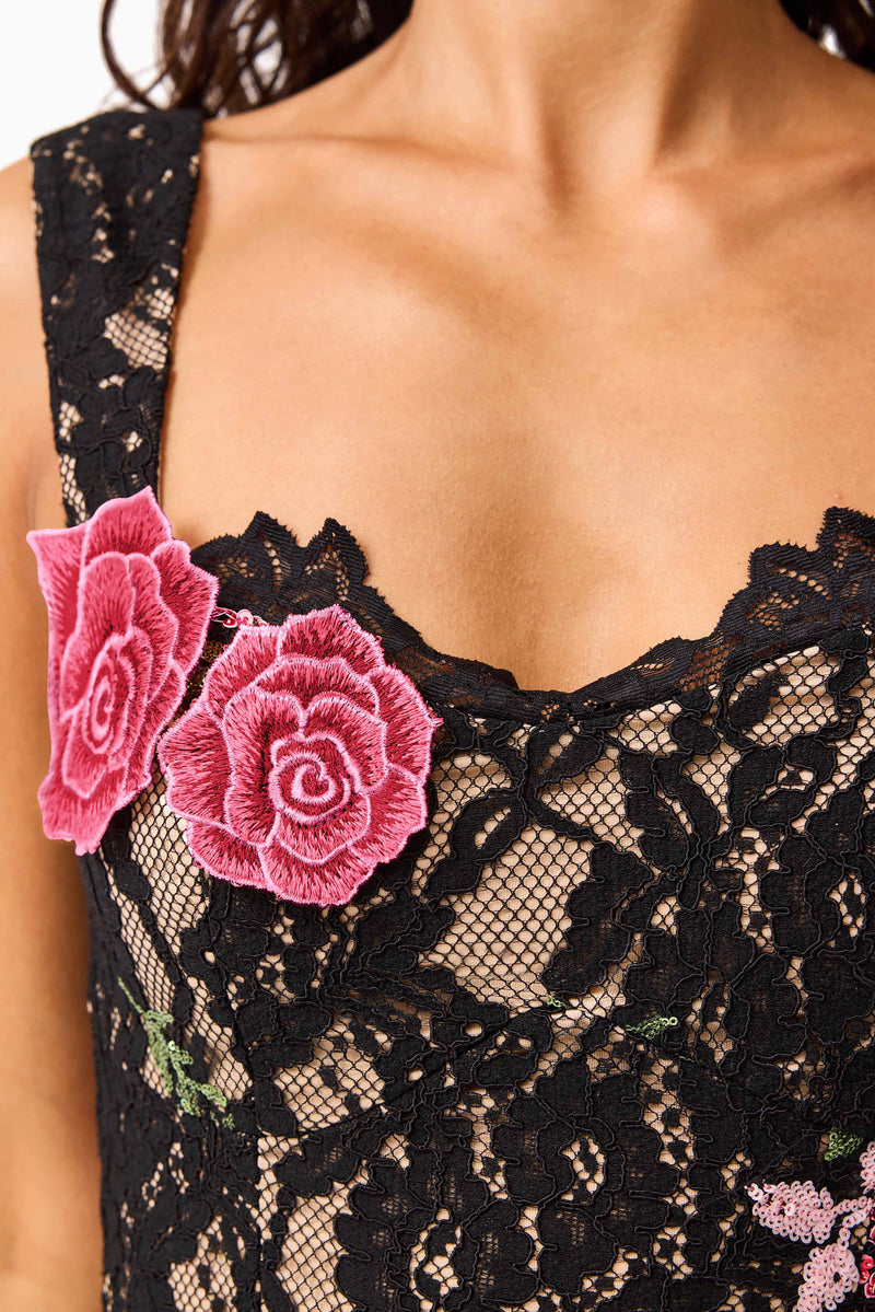 Brunette model wearing the Morgaine Lace Midi Dress in Black detail shot