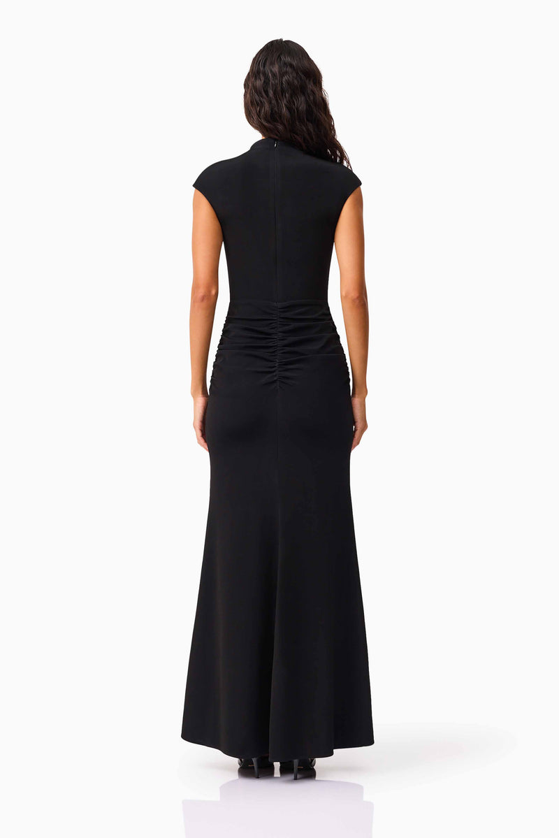 Brunette model wearing the Danica High Neck Gown in Black back shot