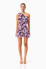 Brunette model wearing the Solene One Shoulder Mini Dress in Purple Floral Front Shot