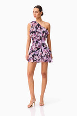 Brunette model wearing the Solene One Shoulder Mini Dress in Purple Floral Posed Shot