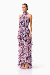 Brunette model wearing Solene Halter Gown in Purple Floral side shot