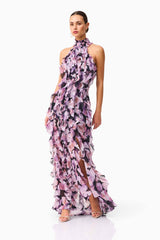 Brunette model wearing Solene Halter Gown in Purple Floral posed shot