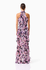 Brunette model wearing Solene Halter Gown in Purple Floral back shot