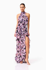 Brunette model wearing Solene Halter Gown in Purple Floral posed shot