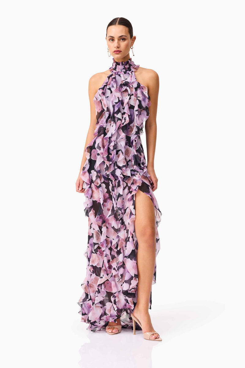 Brunette model wearing Solene Halter Gown in Purple Floral posed shot
