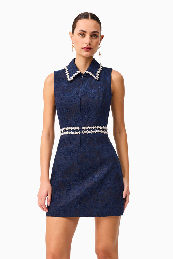 Brunette model wearing Melody Jacquard Mini Dress in Blue posed shot