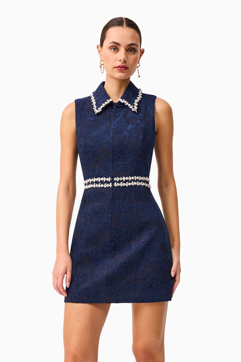 Brunette model wearing Melody Jacquard Mini Dress in Blue posed shot