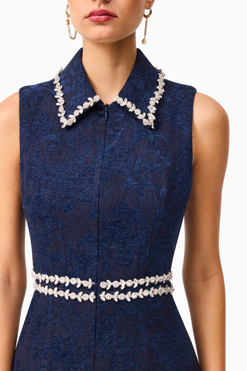 Brunette model wearing Melody Jacquard Mini Dress in Blue detailed shot