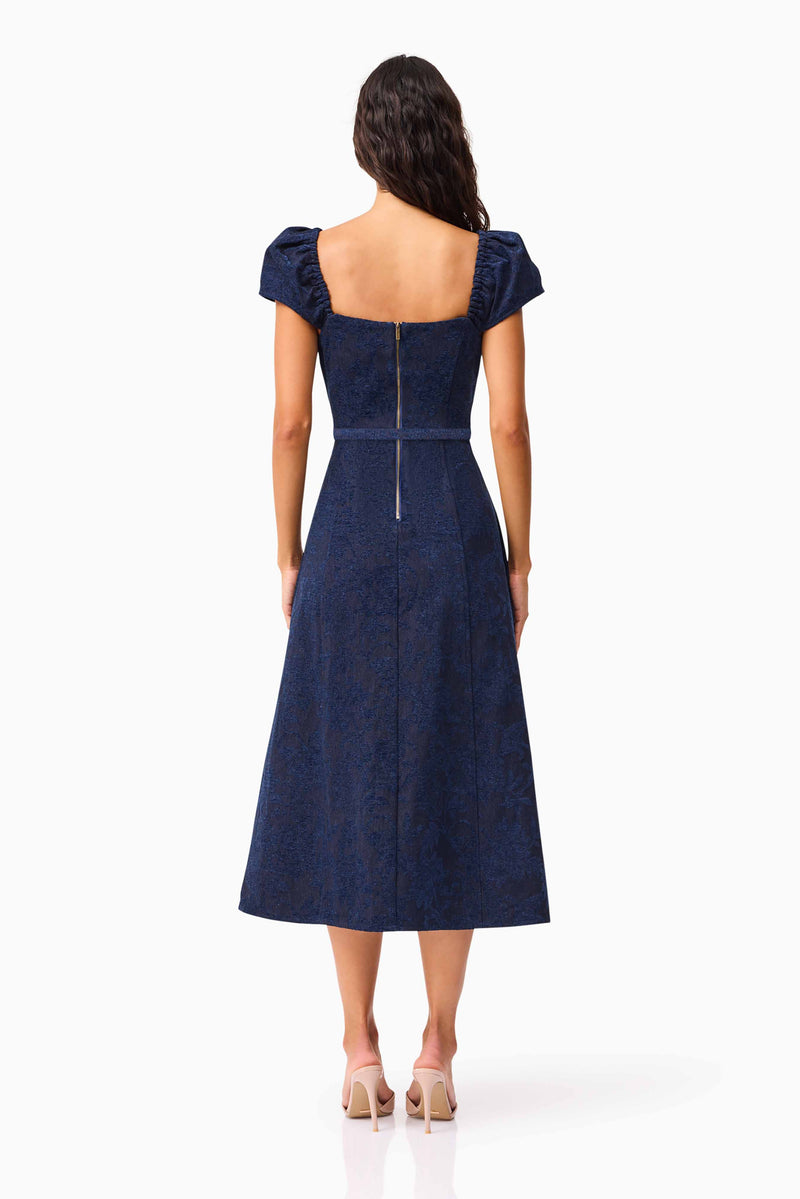 Brunette model wearing Melody Jacquard Short Sleeve Midi Dress in Blue back shot