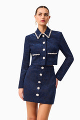 Brunette model wearing Melody Jacquard Top & Skirt Set in Blue hands on hip shot