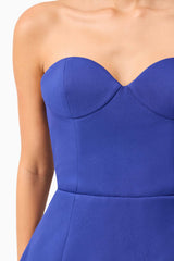 Brunette model wearing Beatrix Tulip Mini Dress in Blue detailed shot