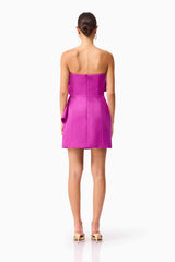 Brunette model wearing the Beatrix Strapless Mini Dress in Purple back shot 