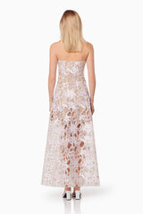 Blonde model wearing the Connection Maxi Gown In Purple back shot