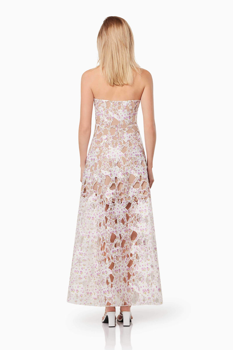 Blonde model wearing the Connection Maxi Gown In Purple back shot