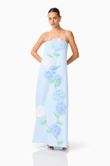 Brunette model wearing the Buttercup Embroidered Maxi Dress In Blue posed shot
