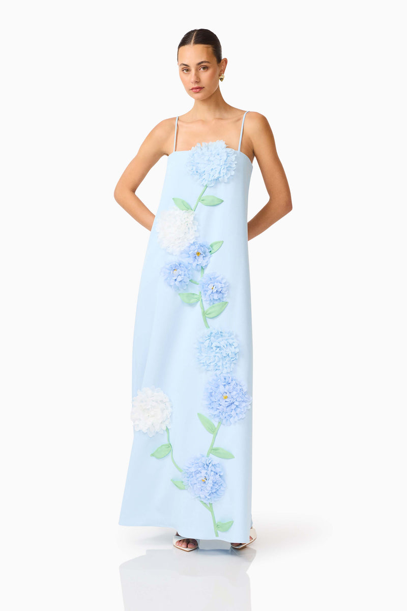 Brunette model wearing the Buttercup Embroidered Maxi Dress In Blue posed shot