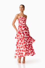 Brunette model wearing the Melia Tiered Gown in Pink and Red Floral posed shot