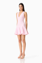 Brunette model wearing the Marla V-Neck Mini Dress in Pink side shot