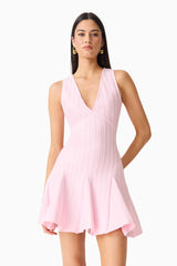Brunette model wearing the Marla V-Neck Mini Dress in Pink close up shot