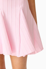 Brunette model wearing the Marla V-Neck Mini Dress in Pink detail shot
