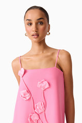 Brunette model wearing the Nolana Floral Applique Gown in Pink detail shot