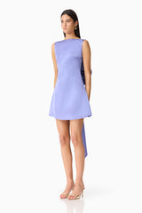 Brunette model wearing the Jacinta Shift Mini Dress side shot