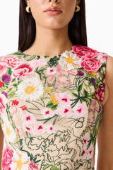 Brunette model wearing Flora Tulip Mini Dress in Pink & Green Floral detail shot