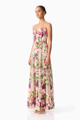 Brunette model wearing the Flora Strapless Gown in Pink & Green Floral side shot