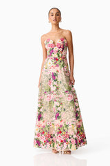 Brunette model wearing the Flora Strapless Gown in Pink & Green Floral posed shot