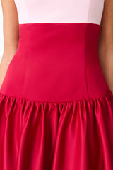 Brunette model wearing the June A-Line Gown in Red and Pink detail shot
