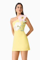 Brunette model wearing Hope One Shoulder Mini Dress in Yellow posed side shot