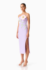 Brunette model wearing the Hope Strapless Midi Dress in Purple side shot 