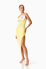 Brunette model wearing the Hope Strapless Midi Dress in Yellow side shot 