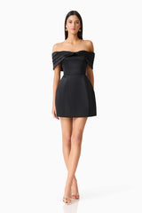 Brunette model wearing Hope Off The Shoulder Mini Dress in Black posed shot