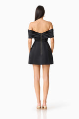 Brunette model wearing Hope Off The Shoulder Mini Dress in Black back shot