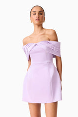 Brunette model wearing the Hope Off the Shoulder Mini Dress in Purple close up posed shot 