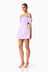 Brunette model wearing the Hope Off the Shoulder Mini Dress in Purple side shot 